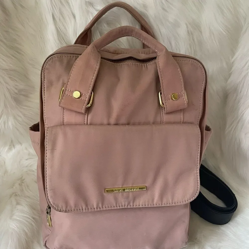 Steve Madden Nylon blush pink backpack with black embroidery back straps.